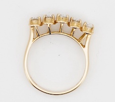 A modern 18ct gold and five stone oval cut diamond set half hoop ring, size N, gross weight 3.8 grams. Condition - fair to good